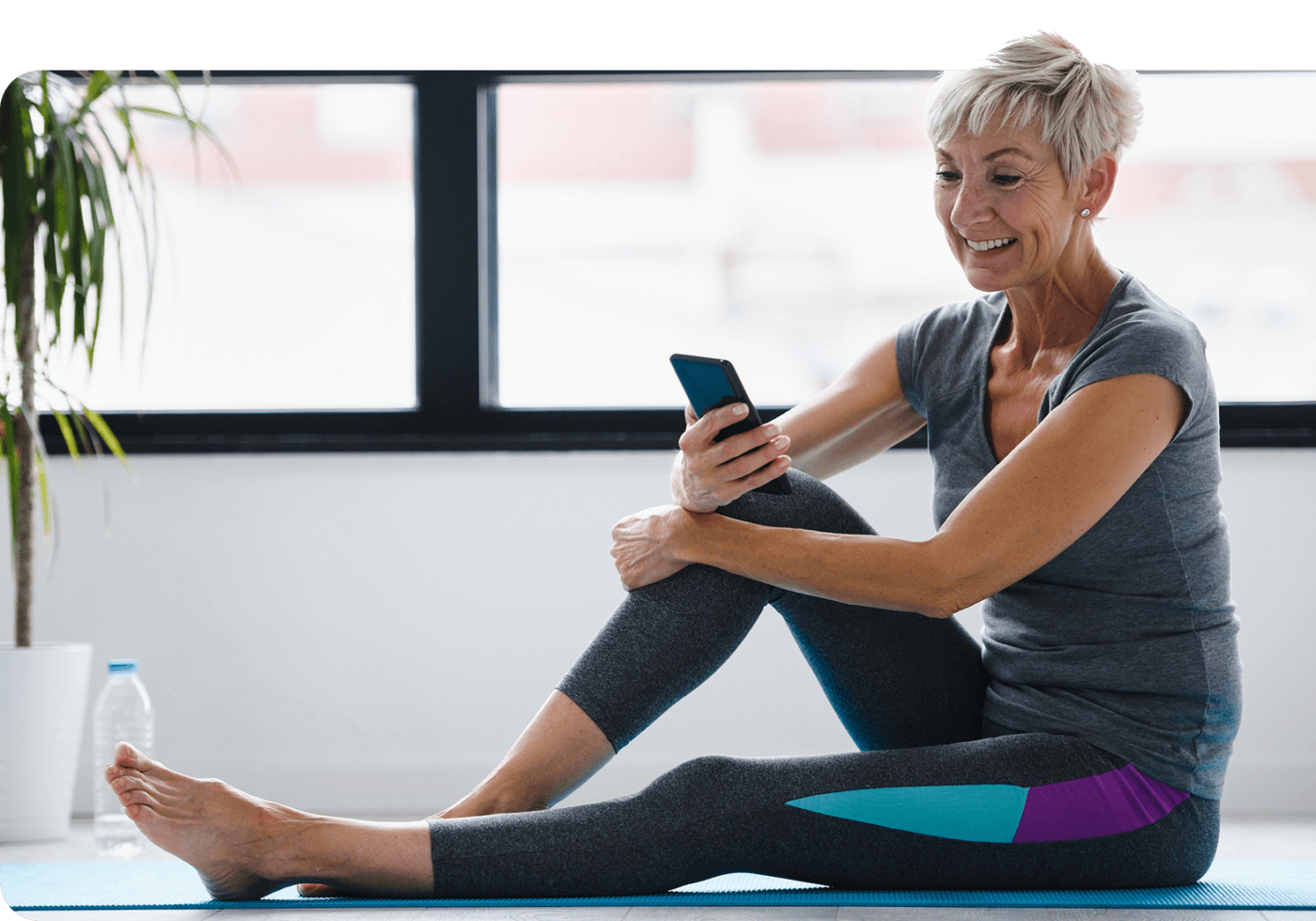Woman Exercising at home with ViewFi on phone.
